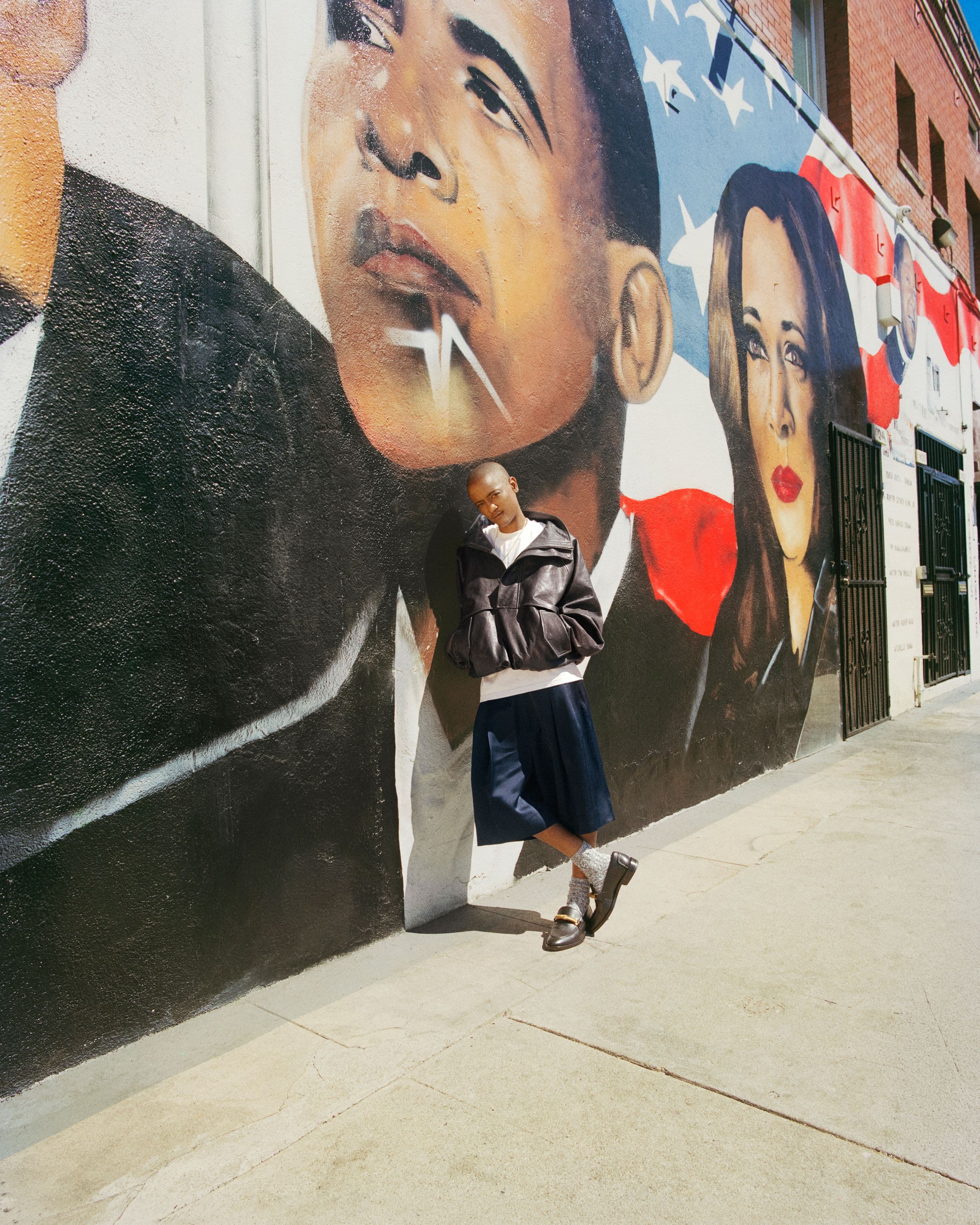 Syd in front of a mural in Los Angeles