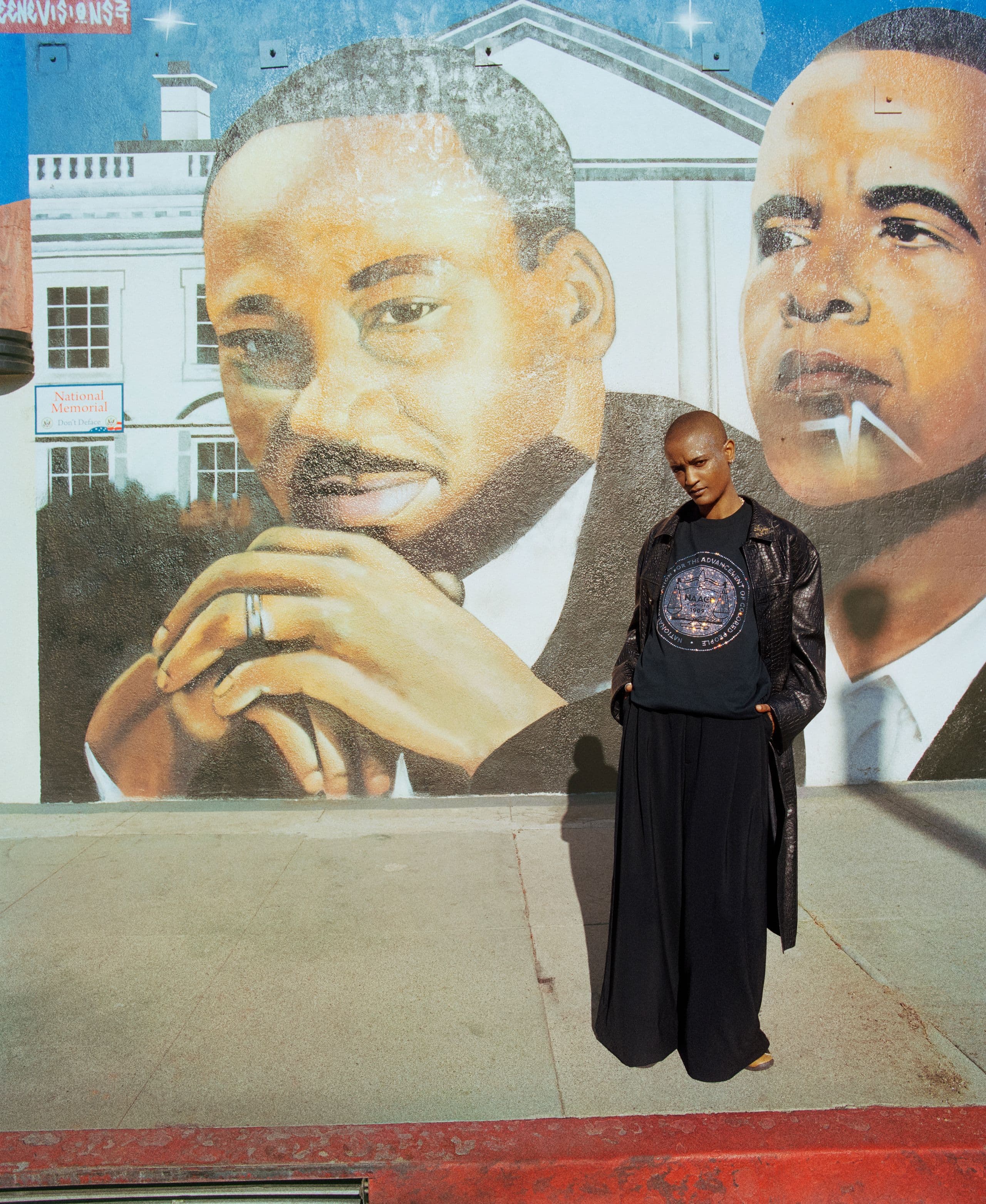 Syd in front of a mural in Los Angeles